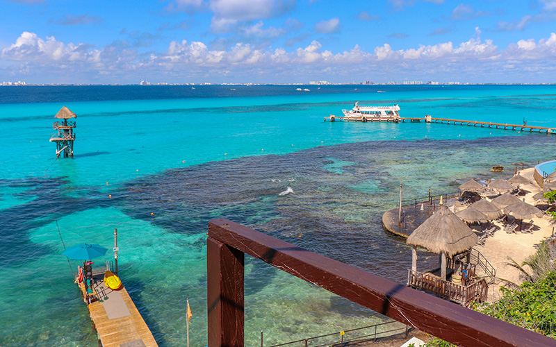 Image of the zipline platform in the middle of the crystal clear waters of the Caribbean Sea.