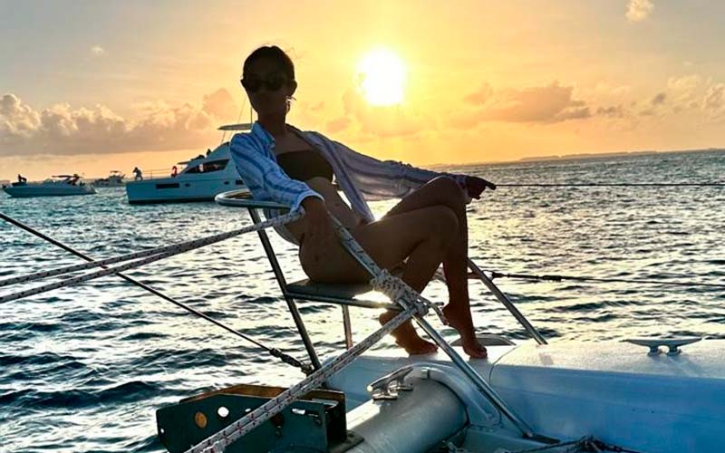 girl at tcatamaran boat in the waters of the caribbean sea off isla mujeresr